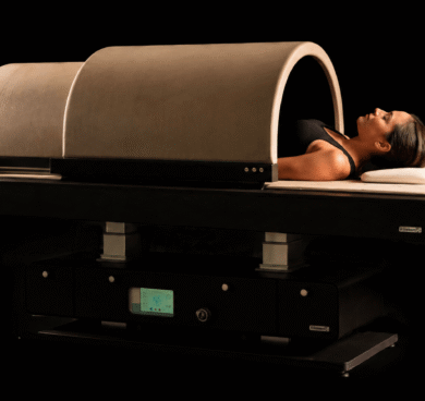Guest enjoying a relaxing spa treatment in a modern wellness capsule at luxury hotel spa.