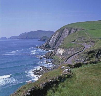 Breathtaking coastal view with rugged cliffs and lush green hills, ideal for serene seaside escapes on Ireland's scenic coast.