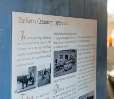 Educational exhibit on Kerry Creamery history with vintage photos, showcasing local heritage for hotel guests.